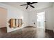 A bedroom with wood flooring, a ceiling fan and an ensuite bathroom at 1114 Oak Knoll Se Ter, Atlanta, GA 30315