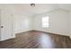 Bright bedroom featuring hardwood floors and a window at 1114 Oak Knoll Se Ter, Atlanta, GA 30315