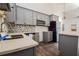 Close up on kitchen showing gray cabinets, stainless steel appliances, and mosaic backsplash at 1114 Oak Knoll Se Ter, Atlanta, GA 30315