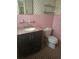 Bathroom with pink tile and black vanity at 1288 N Emory N Pl, Atlanta, GA 30306