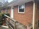 A close-up view of the brick facade and accessible ramp leading to the front entrance at 1288 N Emory N Pl, Atlanta, GA 30306