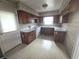 Traditional-style kitchen features wooden cabinets and white appliances at 1288 N Emory N Pl, Atlanta, GA 30306