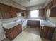 Traditional-style kitchen features wooden cabinets and white appliances at 1288 N Emory N Pl, Atlanta, GA 30306