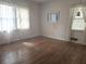 Light-filled living room featuring hardwood floors at 1288 N Emory N Pl, Atlanta, GA 30306