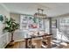 Bright and airy dining room features a large window and modern lighting at 845 Connell Ln, Lawrenceville, GA 30044