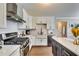 Beautiful kitchen with stainless steel appliances, white cabinets, and modern countertops at 845 Connell Ln, Lawrenceville, GA 30044