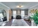 Stylish living room with large windows, a piano, and comfortable seating at 845 Connell Ln, Lawrenceville, GA 30044