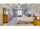 Bright main bedroom with a tray ceiling, plush carpet, and coordinated furnishings at 845 Connell Ln, Lawrenceville, GA 30044