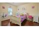 Charming bedroom with a white, ornate bed frame, and a playful decor, perfect for a room at 164 Charolais Dr, Mcdonough, GA 30252