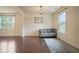 Cozy living room with hardwood floors, natural light, and a comfortable gray sofa at 164 Charolais Dr, Mcdonough, GA 30252