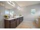 The main bathroom features a double vanity, large mirror, and a tiled floor at 164 Charolais Dr, Mcdonough, GA 30252