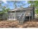 Backyard with a small, private deck and steps to the yard at 2106 Singer Way, Lithonia, GA 30058