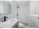 Modern bathroom featuring a stand up shower with white marbled tile walls at 2106 Singer Way, Lithonia, GA 30058