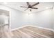 Light filled bedroom with hardwood floors and a ceiling fan at 2198 Star Mist Sw Dr, Atlanta, GA 30311