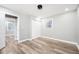 Clean bedroom featuring neutral colors, a closet, and wood-look flooring for a minimalist style at 2198 Star Mist Sw Dr, Atlanta, GA 30311