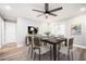 Elegant dining room with modern lighting, stylish furniture, and wood flooring, perfect for gatherings at 2198 Star Mist Sw Dr, Atlanta, GA 30311