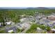 Scenic aerial view of a town featuring lush foliage, train tracks and a mix of residential and commercial buildings at 319 Atlanta Se St # 110, Marietta, GA 30060