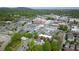 Picturesque aerial view of a charming town with train track, showcasing lush greenery and diverse architectural styles at 319 Atlanta Se St # 110, Marietta, GA 30060