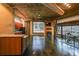 Open-concept living space with modern kitchen, fireplace, and concrete floor at 319 Atlanta Se St # 110, Marietta, GA 30060