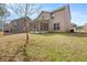 View of a home's backyard, patio, and exterior at 3257 Alhambra Cir, Hampton, GA 30228