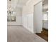 Dining area featuring wainscoting, a modern chandelier, and an opening to the kitchen at 3257 Alhambra Cir, Hampton, GA 30228