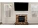 A stone fireplace with a flatscreen TV in a living room at 3257 Alhambra Cir, Hampton, GA 30228