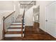 Elegant foyer with hardwood floors, staircase with iron spindles, and an open view to the upper level at 3257 Alhambra Cir, Hampton, GA 30228