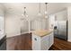 Kitchen island with granite countertop in a modern kitchen at 3257 Alhambra Cir, Hampton, GA 30228