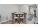 Cozy dining area featuring modern furnishings and wood look floors with an adjacent entryway at 5019 Lower Elm St, Atlanta, GA 30349