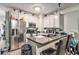 Well-equipped kitchen features stainless steel appliances, stone countertops, and ample cabinet space at 5019 Lower Elm St, Atlanta, GA 30349