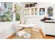 Charming breakfast nook with bright sunlight, round table and view of kitchen at 565 Candler St, Atlanta, GA 30307