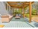 A covered porch offers comfortable seating and a ceiling fan for outdoor relaxation and enjoyment at 565 Candler St, Atlanta, GA 30307