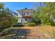 Charming two-story home features a spacious backyard and a covered porch for outdoor entertaining at 565 Candler St, Atlanta, GA 30307