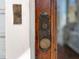 Close up of the wooden door with vintage hardware and ornate detailing at 565 Candler St, Atlanta, GA 30307