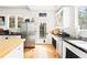 Bright kitchen with stainless steel appliances, butcher block island and ample natural light at 565 Candler St, Atlanta, GA 30307