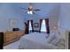 Bedroom featuring a ceiling fan, white furniture, a window and carpet floors at 5990 Mountain Top Pl, Cumming, GA 30041