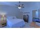 Bedroom with a ceiling fan, white furniture and a window at 5990 Mountain Top Pl, Cumming, GA 30041