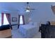 Bedroom featuring a ceiling fan, white furniture, a window and carpet floors at 5990 Mountain Top Pl, Cumming, GA 30041