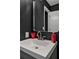 Modern bathroom sink and dark accent wall at 10330 Wisteria Ln, Jonesboro, GA 30238
