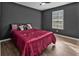 Bedroom showcasing hardwood floors and natural light from window at 10330 Wisteria Ln, Jonesboro, GA 30238
