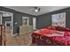 Bedroom showcasing natural light, wood-look floors, and neutral colors at 10330 Wisteria Ln, Jonesboro, GA 30238