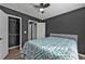 Well-lit bedroom with a closet, and a ceiling fan offering comfort and functionality at 10330 Wisteria Ln, Jonesboro, GA 30238