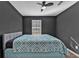 Inviting bedroom with modern ceiling fan, white trim, and a sunny window for a bright, airy ambiance at 10330 Wisteria Ln, Jonesboro, GA 30238