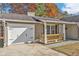Charming single-story home featuring a one-car garage and welcoming front porch at 10330 Wisteria Ln, Jonesboro, GA 30238
