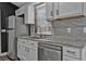 Close up of the updated kitchen with stainless steel appliances and granite counters at 10330 Wisteria Ln, Jonesboro, GA 30238