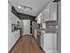 Updated kitchen with white cabinets, stainless steel appliances, and hardwood floors at 10330 Wisteria Ln, Jonesboro, GA 30238