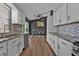 Kitchen featuring stainless steel appliances, counter seating and access to back porch at 10330 Wisteria Ln, Jonesboro, GA 30238