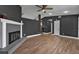 Spacious living room featuring hardwood floors and a fireplace at 10330 Wisteria Ln, Jonesboro, GA 30238