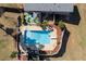 Aerial view of backyard pool, patio, and lush landscaping at 2007 Manassas Dr, Woodstock, GA 30189