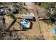 Aerial view of home with pool, patio, and fenced yard at 2007 Manassas Dr, Woodstock, GA 30189